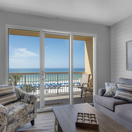 Unwind in your coastal living room where panoramic ocean views and gentle sea breezes create the perfect beachfront retreat.