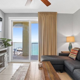Relax in your bright living room where ocean views and coastal breezes flow through sliding doors to your private balcony.