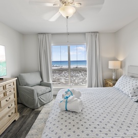 Wake up to stunning ocean views in your peaceful bedroom, where comfort meets coastal charm with thoughtful touches awaiting your arrival.