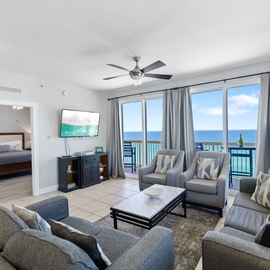 Relax in your spacious oceanfront living room where stunning sea views greet you through floor-to-ceiling windows and coastal breezes drift across comfortable seating.