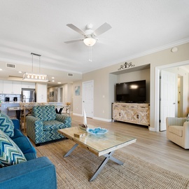 Your bright, open living space flows seamlessly from cozy seating to modern kitchen, perfect for unwinding after beach days.