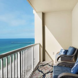 Your private oceanfront balcony awaits with comfortable seating where you can savor morning coffee and stunning Gulf views.