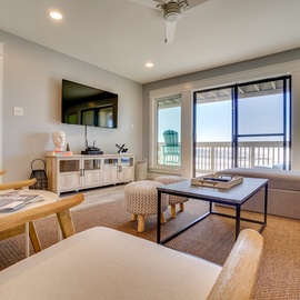 Relax in your bright, coastal-inspired living space with ocean views and modern comfort awaiting your perfect beach getaway.