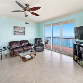 Sink into leather comfort while gazing at endless ocean views through floor-to-ceiling windows in your coastal living room.