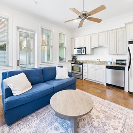 Relax on your cozy blue sectional while cooking in your fully-equipped kitchen with stainless steel appliances and granite countertops.