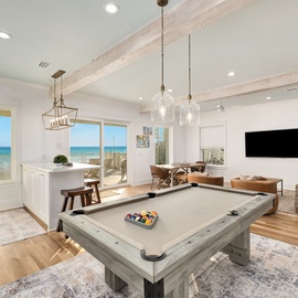 Your game room features stunning ocean views while you play pool or relax in modern comfort with premium entertainment.