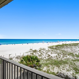 Sweeping beachfront views from your private balcony showcase pristine white sand and azure waters stretching to the horizon.