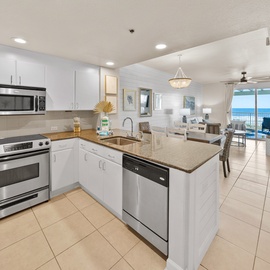 Cook your favorite meals in this bright, fully-equipped kitchen with granite counters and stunning ocean views.