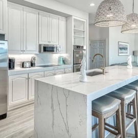 Your fully equipped kitchen sparkles with marble countertops and stainless appliances, perfect for cooking memorable meals together.