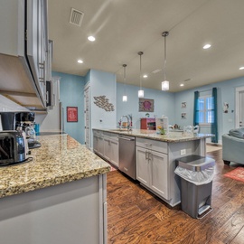 This bright, open-concept space seamlessly blends your gourmet kitchen and cozy living area. Cook with granite counters and stainless appliances while staying connected to relaxation areas bathed in natural light.