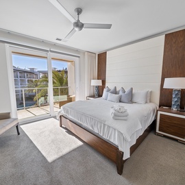 Rest peacefully in your modern bedroom with crisp linens, contemporary walnut furnishings, and French doors opening to your private balcony.