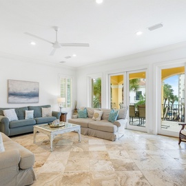 Relax in your spacious living room with coastal-chic furnishings and French doors opening to your private outdoor terrace.