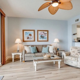 Relax in your bright living space with coastal charm, comfortable seating, and your own kitchen for easy meal prep.