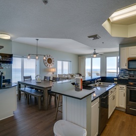 Your spacious open-concept kitchen flows seamlessly into the dining and living areas, where you can cook, dine, and relax while enjoying stunning ocean views.
