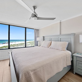 Wake up to stunning beach views from your king bed. The gentle ceiling fan and soft linens create your perfect coastal retreat.