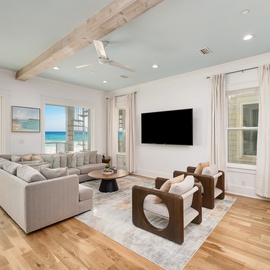 Sink into plush seating while ocean waves crash just outside your windows in this bright, airy living space with stunning sea views.