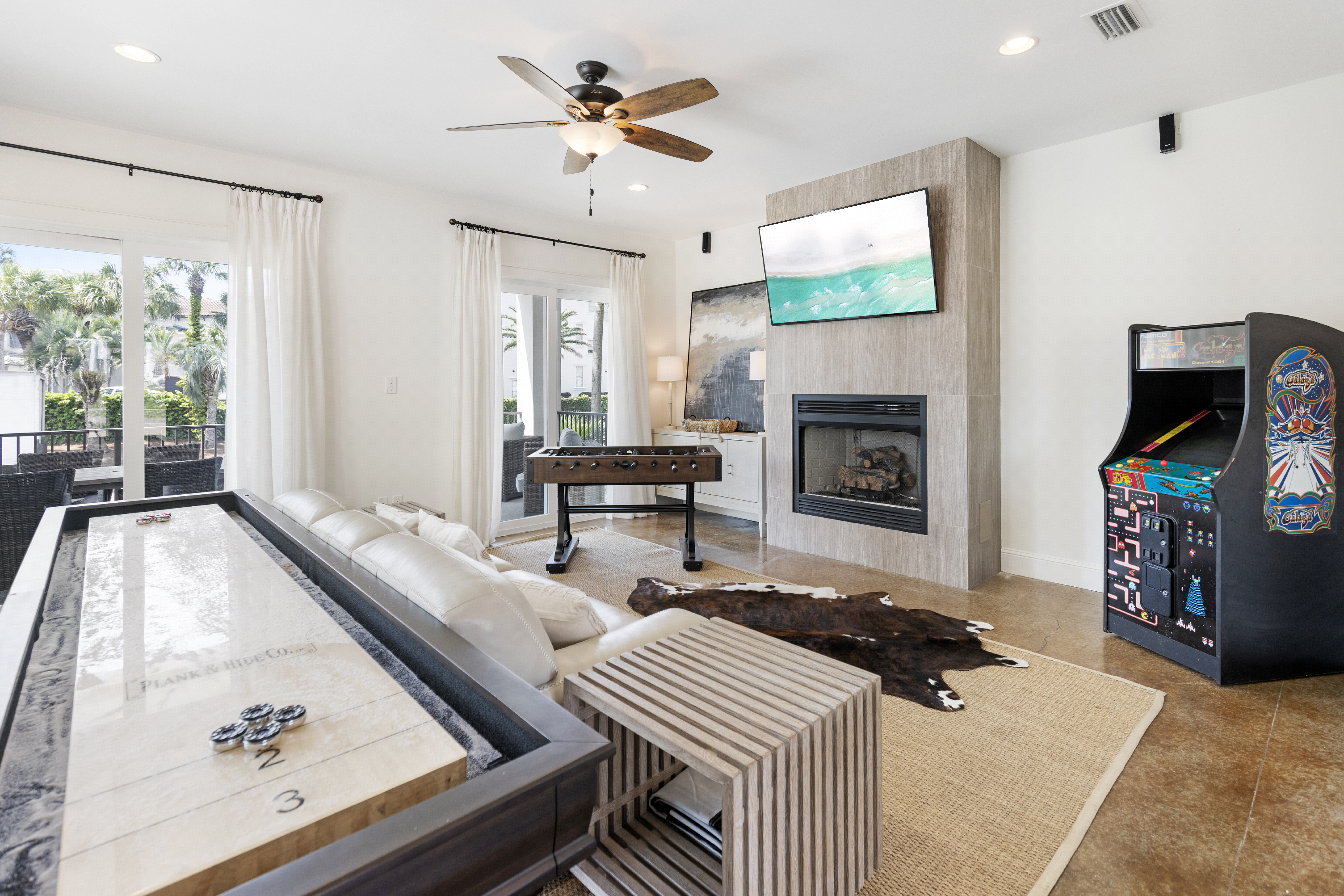 Challenge friends to foosball and arcade games in your entertainment lounge, complete with fireplace and flat-screen for cozy evenings.
