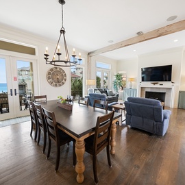 Your open-concept living space seamlessly blends comfort and coastal elegance, with stunning ocean views framing memorable meals and cozy evenings by the fireplace.