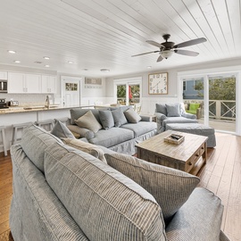 Relax in your spacious open-plan living area with plush seating and a gourmet kitchen, perfect for memorable evenings.