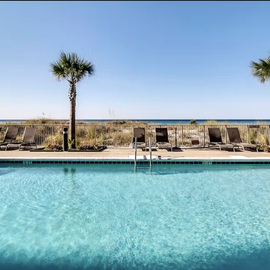 Take a refreshing dip in the sparkling pool, surrounded by swaying palms and comfortable loungers where you can soak up the sun.