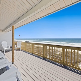 Your private beachfront deck offers stunning ocean views with comfortable seating for morning coffee or sunset relaxation.