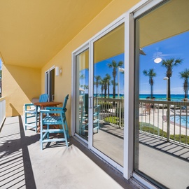 Step onto your private balcony and soak in stunning pool and ocean views through floor-to-ceiling windows that flood your space with natural light.