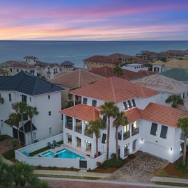 Stunning beachview estate with private pool and hot tub in exclusive coastal community, featuring Mediterranean-style architecture near pristine waters.