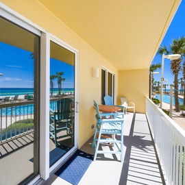 Your private balcony overlooks tropical palms and sparkling pools, with ocean breezes and stunning views creating the perfect spot to unwind.