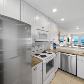 Cook with stunning ocean views in your fully equipped kitchen, featuring stainless steel appliances and everything you need for memorable meals.