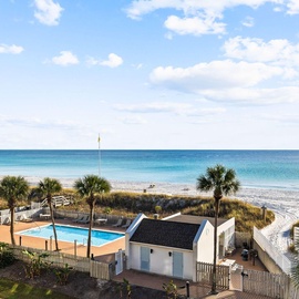 Beachfront property featuring pool access and pristine white sand beach steps away from the accommodation.