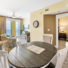 Enjoy your morning coffee at this inviting dining table while taking in the ocean views through your private balcony doors.