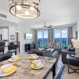 Wake up to stunning ocean views from your spacious condo with modern kitchen, comfortable living space, and private balcony overlooking endless blue waters.
