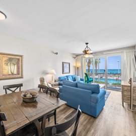Wake up to stunning ocean views from your bright, coastal-themed living space with comfortable seating and dining for memorable beachside mornings.