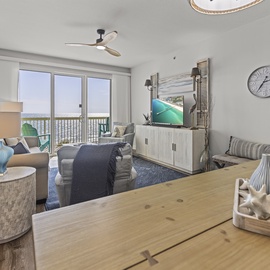 Sink into your spacious living area where coastal comfort meets modern style, with stunning water views from your private balcony.