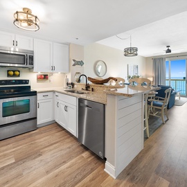 Your gourmet kitchen offers granite counters, stainless appliances, and a breakfast bar where you'll enjoy morning coffee with stunning ocean views.