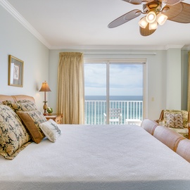 Wake up to stunning ocean views from your private bedroom retreat, where tropical ceiling fans and coastal charm create your perfect seaside sanctuary.