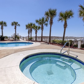 Soak in the hot tub or dive into the sparkling pool while swaying palms frame your perfect beachside escape.