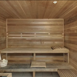 Unwind in your private sauna's warm cedar embrace. Feel stress melt away as aromatic wood surrounds you in this authentic wellness sanctuary.