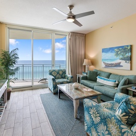 Sink into tropical comfort with stunning ocean views through floor-to-ceiling windows, where coastal-themed furnishings and your private balcony create the perfect seaside retreat.
