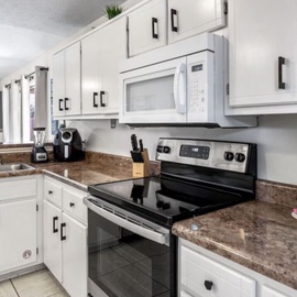 Your fully equipped kitchen features modern appliances and granite countertops, perfect for preparing meals during your stay.