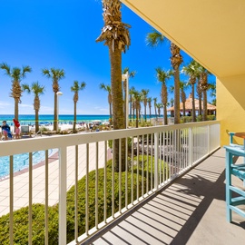 Sip your morning coffee on your private balcony overlooking turquoise waters and swaying palms.