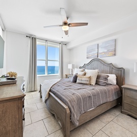 Wake up to stunning ocean views from your comfortable bedroom, complete with coastal decor and modern amenities for the perfect beachside retreat.