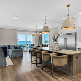 Stunning open-concept living with gourmet kitchen island and breathtaking ocean views from every window.