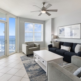 Unwind in your bright living room with stunning ocean views and comfortable seating for your perfect beach getaway.