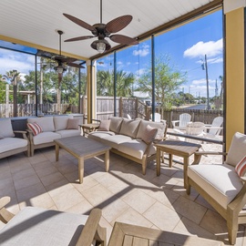 Relax in your screened patio with plush seating and tropical views. The ceiling fan keeps you cool while you enjoy the peaceful atmosphere.
