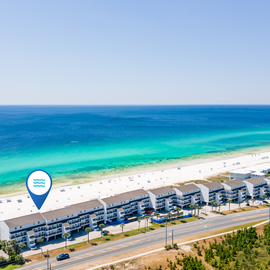 Stunning beachfront location with pristine white sand and crystal-clear turquoise waters just steps from the property.