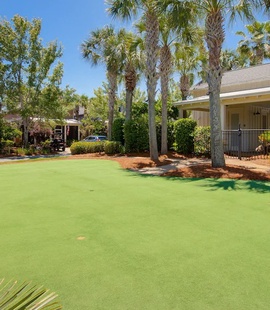 Putting green next to the community pool