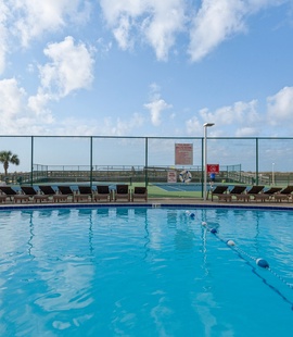 Laze by the Pool at Holiday Surf and Racquet Club