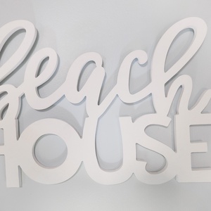 Embrace the beach vibe with this charming wall decor that welcomes you to your coastal getaway