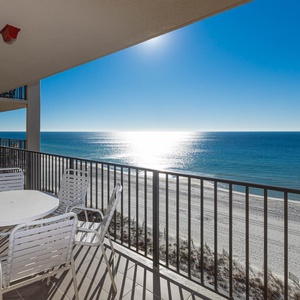 Savor meals at the round table on the balcony while enjoying expansive views of the tranquil water